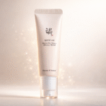 Rice Water Bright Foaming Cleanser and Rice Ceramide Cream skincare products displayed on soft beige background with rice grains, Korean glass skin routine essentials.